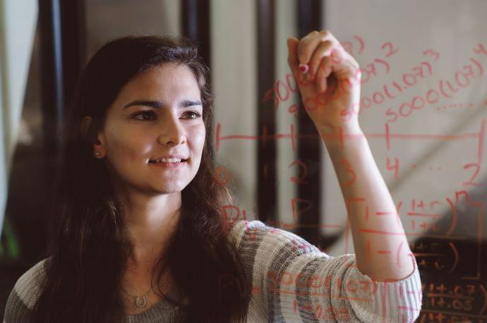 math student writing on glass