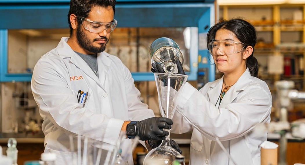 Two students working in a research lab